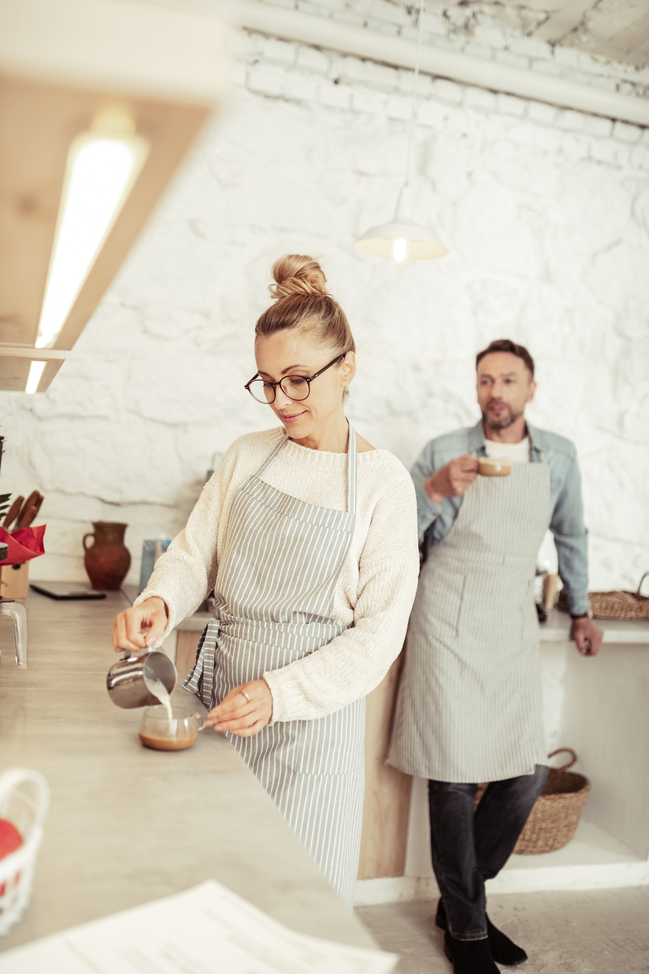 Cozy studio kitchen with people cooking together